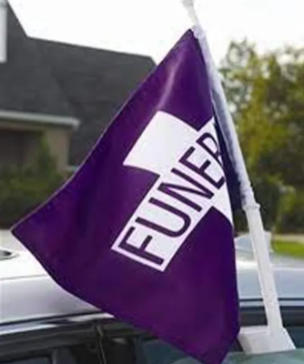 Purple flag with 'FUNERAL' text on a car, with a house and trees in the background.